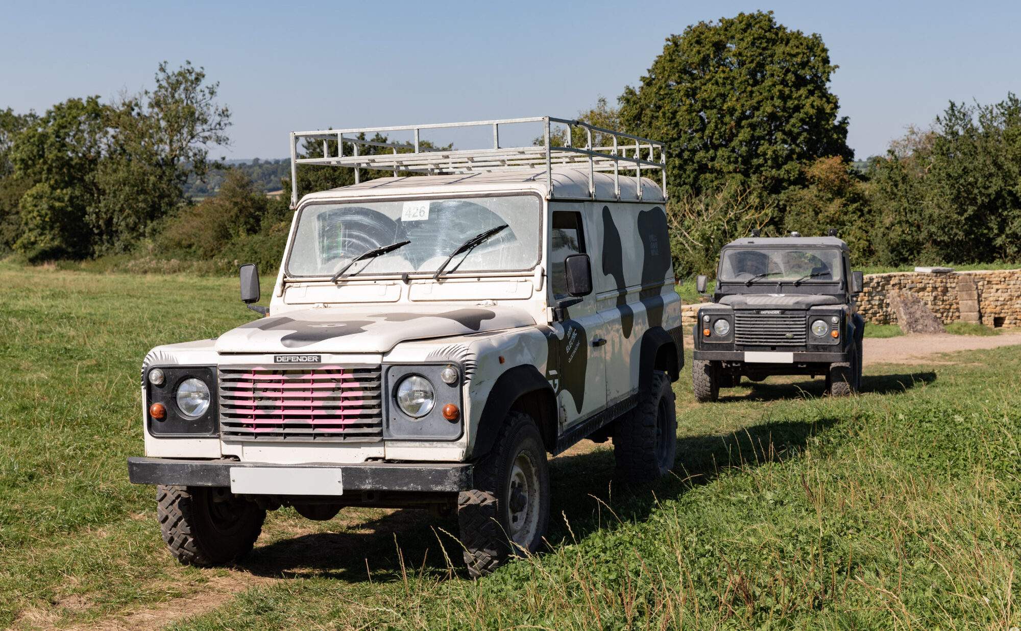 Two electric Land Rover conversions by Electrogenic